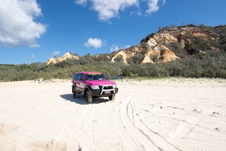 4x4 vehicle-driving-on-the-beach-pink 4wd-fraser-island-2-days-tour